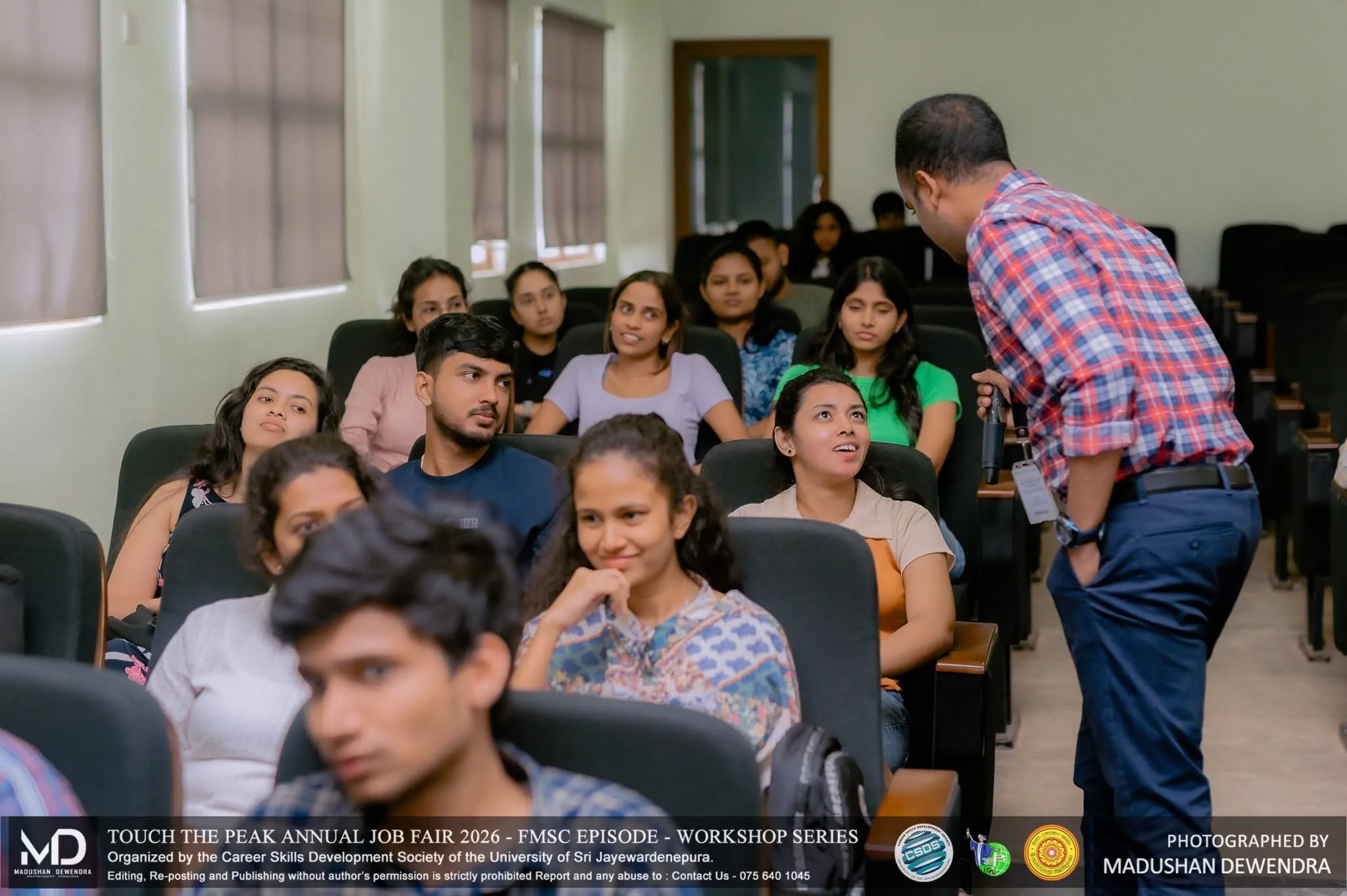 Workshop speaker talking with students
